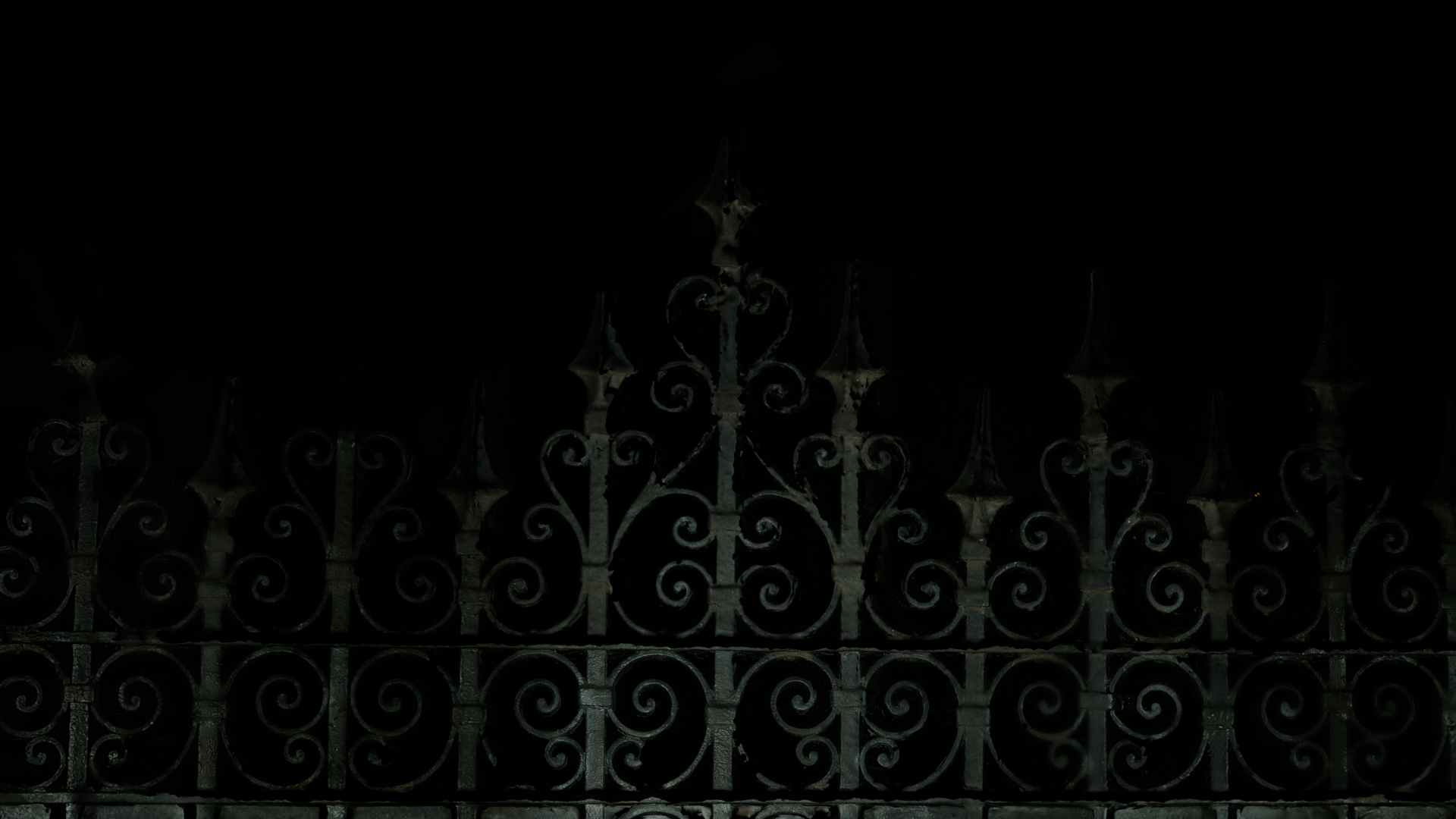 an indexed gate with curly whimsical lines